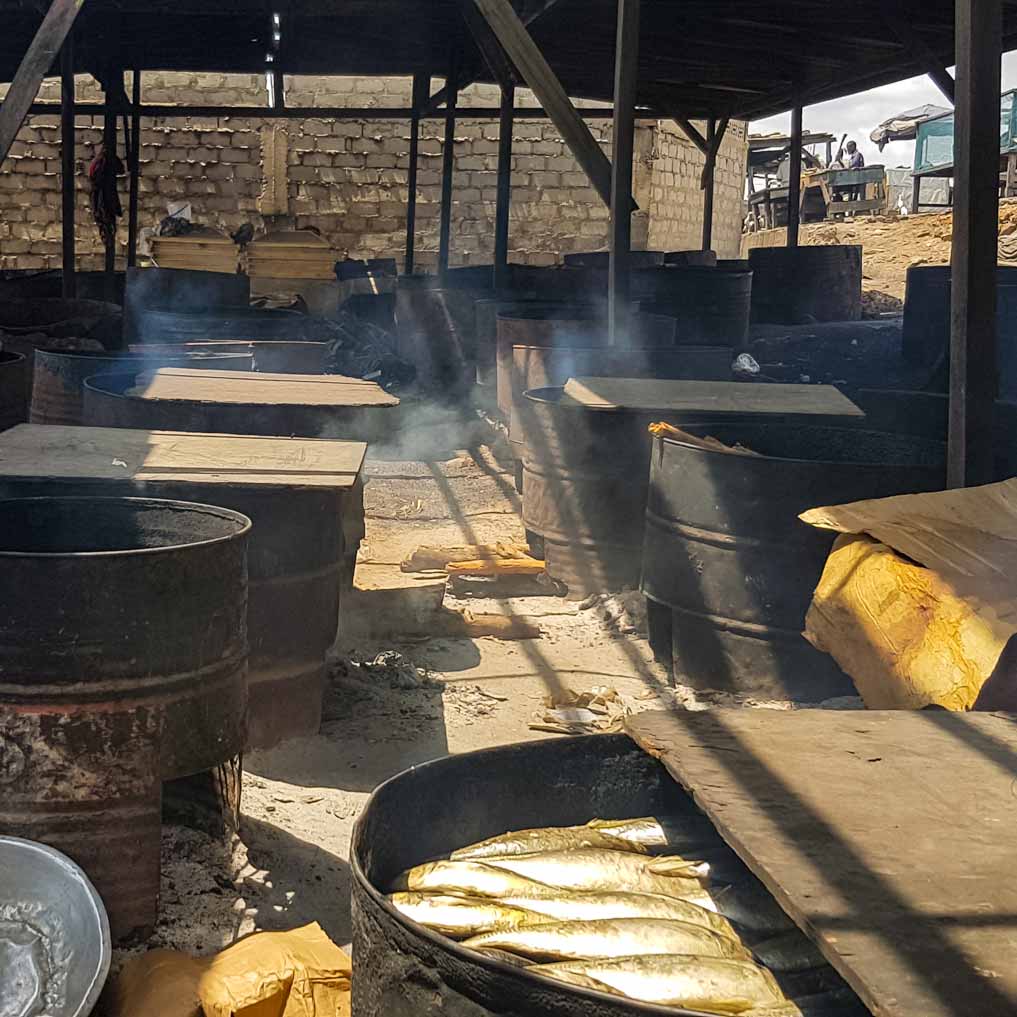 Smoking of fish over an open fire with wood at Jamestown, Accra, Ghana | Air Pollution in Ghana| Muntaka Chasant|